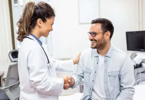 APPOINTMENT INFO 1 Physician greeting a patient for a Direct Primary Care membership visit